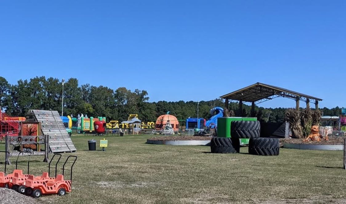 Inflatables, a giant pumpkin, monster-truck tires, and the pavilion stage on the midway