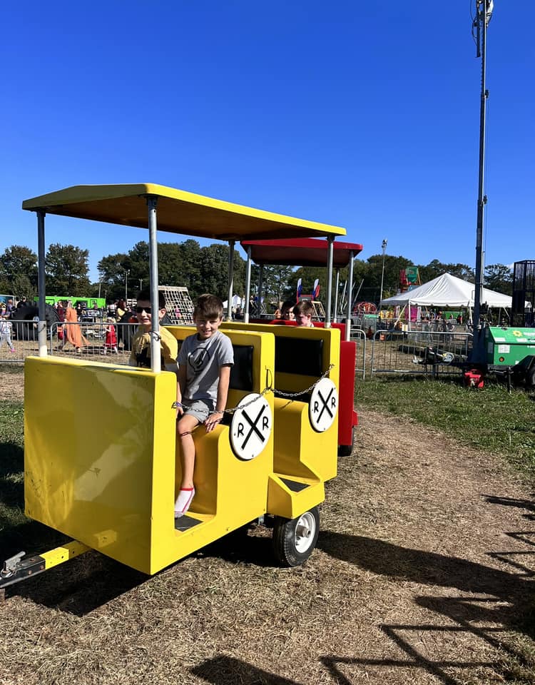 Kids riding in the yellow car of Chubby's Express train